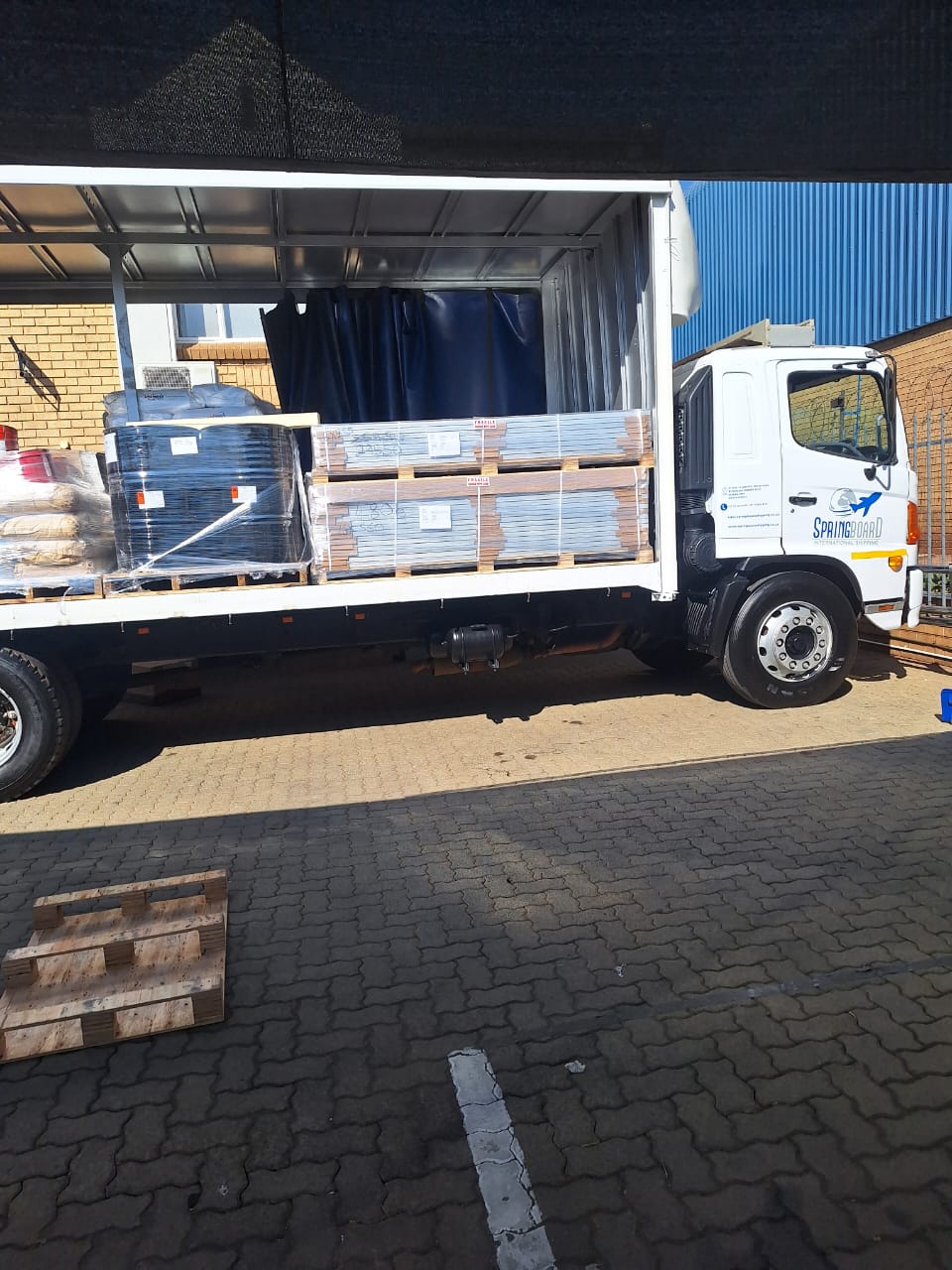 Springboard truck loaded with imported cargo